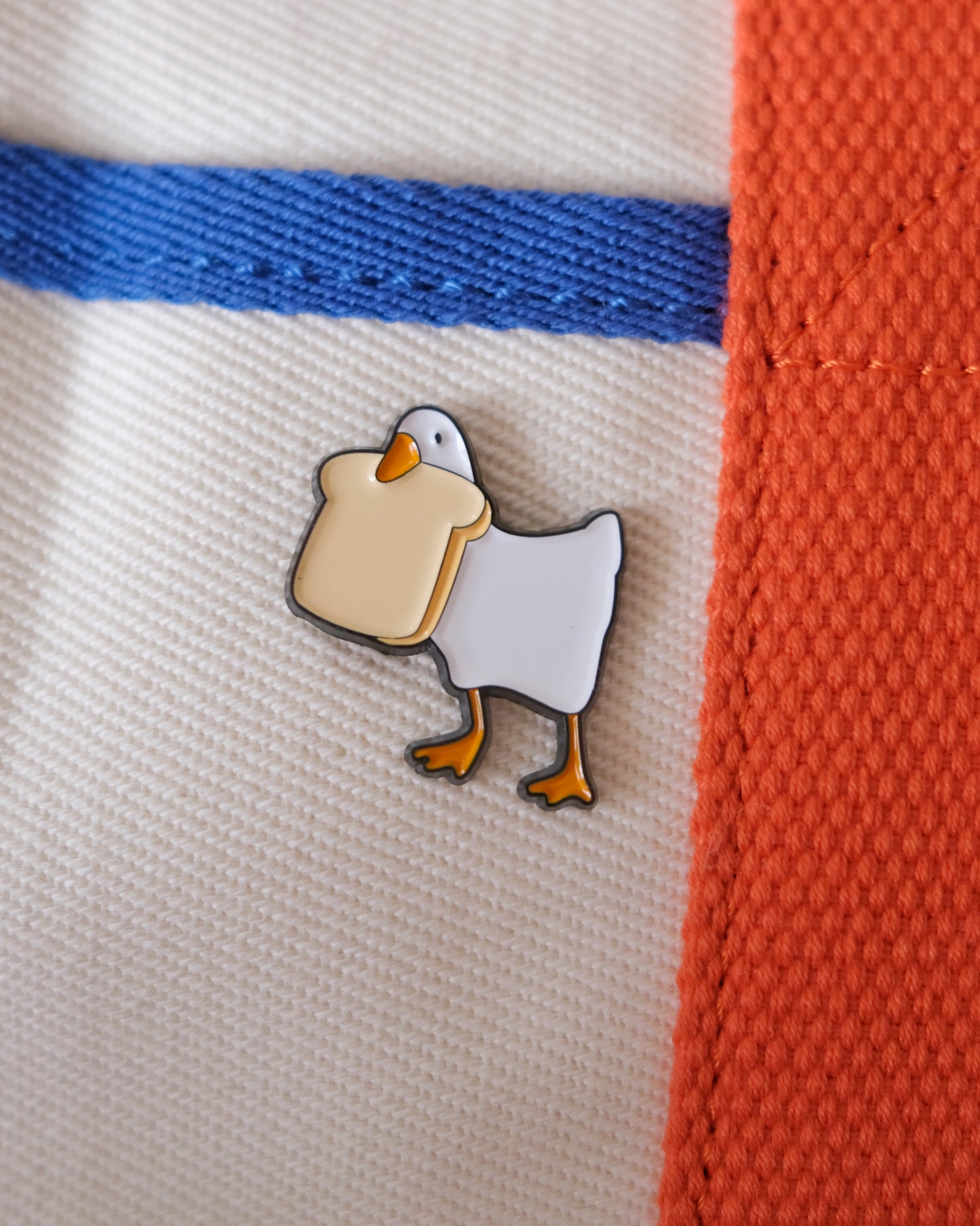 Goose with Bread Enamel Pin.